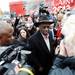 Republican presidential candidate Herman Cain smiles as he makes his way past supporters and media into the Big Sky Diner in Ypsilanti during a stop on Thursday morning. Melanie Maxwell I AnnArbor.com